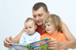 © Renata Osinska - young father reading fairy tale to children