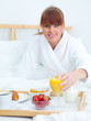 © Dash - Beautiful woman eating breakfast in bed