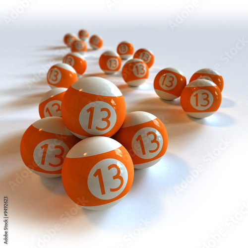 Orange billiard balls with number 13 against white background