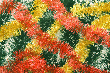 Background from a tinsel of red, yellow and green color.