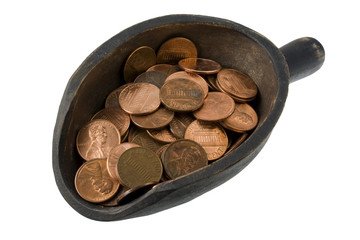 US pennies on a wooden scoop - money concept