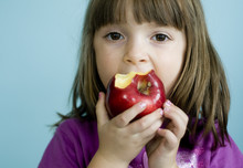 Child Eating Healthy Apple Snack