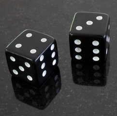 a pair of dice that have rolled a seven