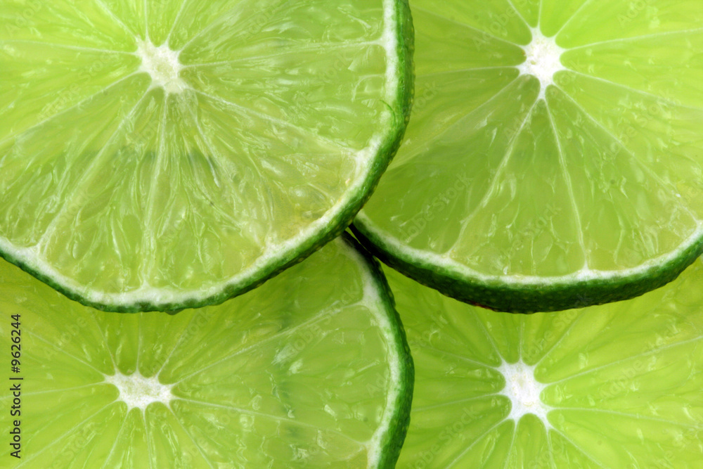 A cut green lime isolated on a white background