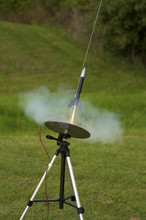 Model Rocket Launching In A Cloud Of Smoke