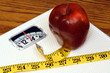 © RoJo Images - Scale, Tape Measure and Apple dieting concept
