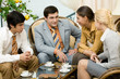 © pressmaster - Portrait of four confident business people at meeting