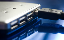 USB Hub  Isolated On A Blue Reflective Surface.