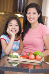 Wall Mural - Mother And Daughter Preparing meal,mealtime Together