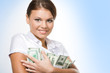 © pressmaster - Portrait of young woman holding money