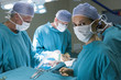 © Monkey Business - Four Surgeons Getting Ready To Operating On A Patient