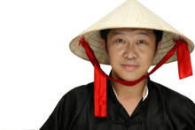 Friendly Asian Man With Conical Hat