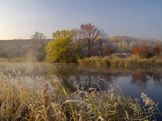 Autumn wood lake and the first morning hoarfrost