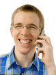 Young man talking happily on the phone