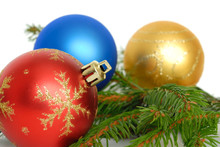 Christmas Baubles And Green Branch On White Background
