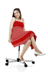 Sticker - Young beautiful woman seated on a chair with a happy face