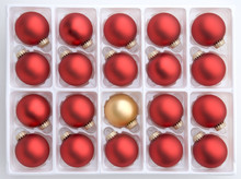 Group Of Red Christmas Decorations With Single Gold Bauble
