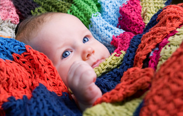 Wall Mural - Portrait of three month old baby girl with big blue eyes