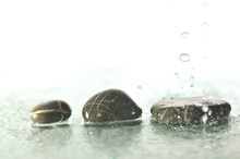 Isolated Wet Zen Stones With Splashing  Water Drops