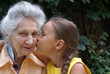 © cabania - Granddaughter and her grandmother talking