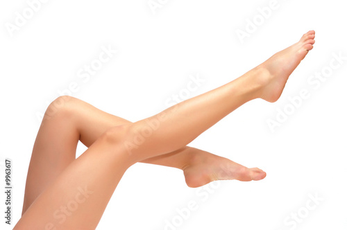 Long pretty woman legs isolated on white Poster Mural XXL