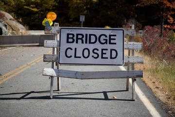 Bridge Closed sign with concrete barricade
