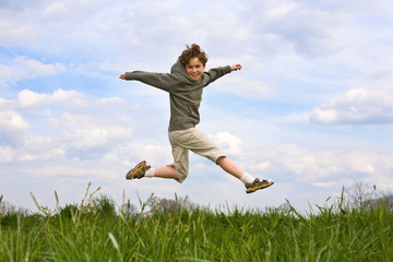 Wall Mural - Boy running, jumping outdoor