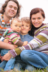 Wall Mural - Family of four portrait on nature