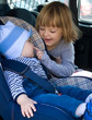 © Renata Osinska - baby boy and little girl laughing in car backseat
