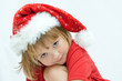© Renata Osinska - Christmas kid in Santa hat on white background