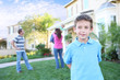 © Stephen Coburn - A happy family having fun outdoors in front of their home
