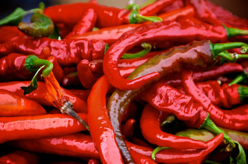 large red hot peppers at outdoor farmers market