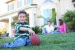 © Stephen Coburn - A happy family having fun outdoors in front of their home