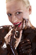 © Duey - Attractive naked blond girl covered in chocolate looking