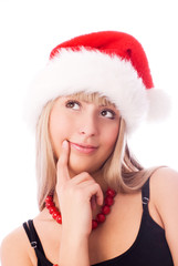  beautiful thoughtful girl wearing Santa's hat