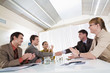 © pressmaster - Image of happy business leaders handshaking at meeting