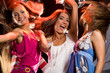 © pressmaster - Photo of joyful teenage girls having fun on dance floor
