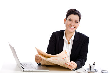 Businesswoman reading financial newspaper,