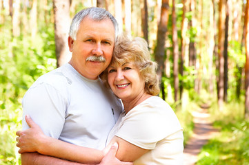 Wall Mural - Smiling happy  elderly couple in love outdoor .