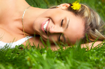 Wall Mural - beautiful woman relaxing in the summer park.