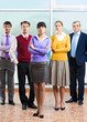 © pressmaster - Photo of confident managers standing in office
