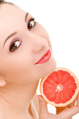 Wall Mural - pretty woman with orange isolated on the white background