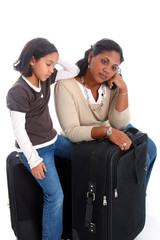 Wall Mural - Woman and daughter with their suitcases ready to travel