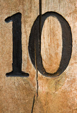 Number Ten On Craced Wood Desk