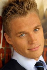 Close-up portrait of young male model in tie..