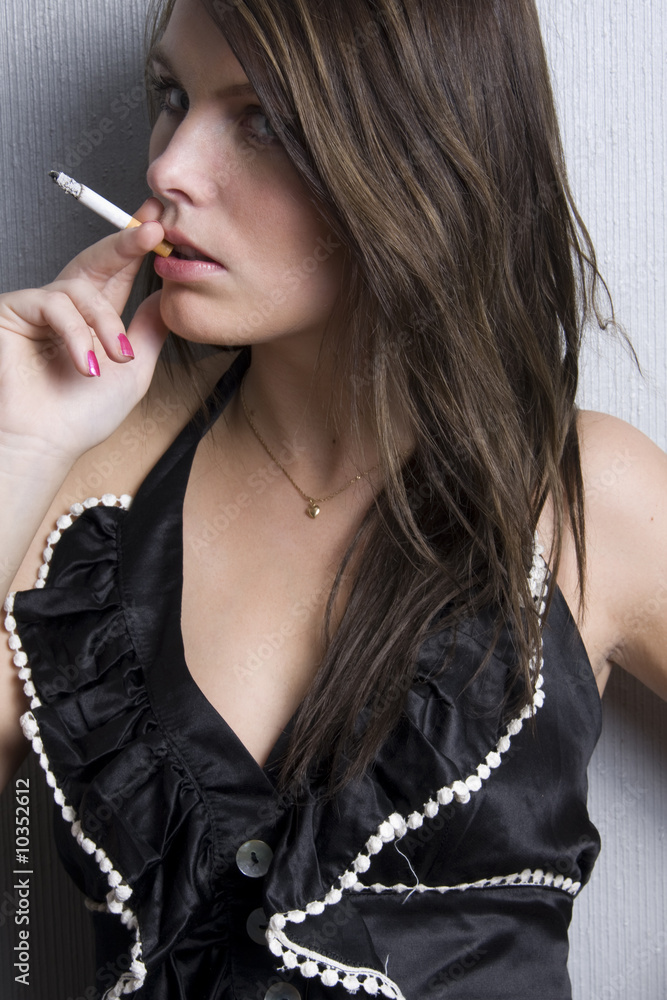 model cigarette Portrait of beautiful young fashion model smoking a cigarette Stock Photo