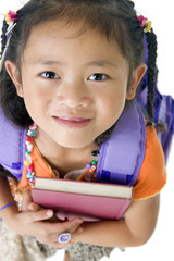 Wall Mural - A young asian school girl ready for school.