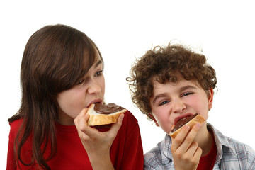 Kids eating bread with peanut butter