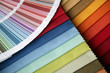 samples of a fabric and opened color card with various colors