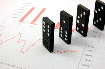 Poster - domino over business chart showing the risk